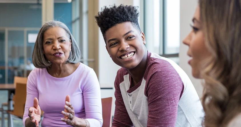 A therapist talking with a mother and her teenage son