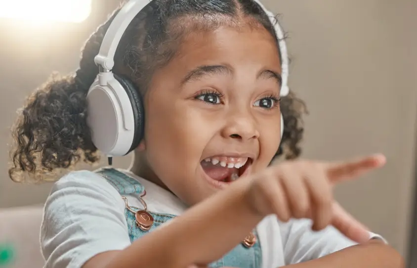 A child using headphones in a therapy session