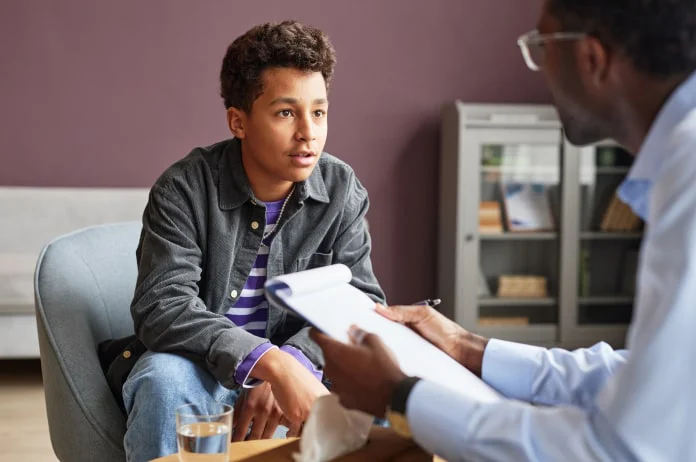 A child talking with a therapist